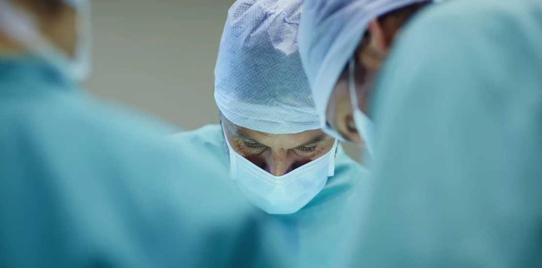 Microsurgeons performing surgery - microsurgery